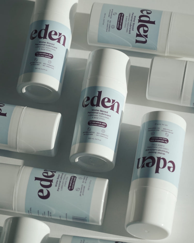 Multiple bottles of Eden products on a white surface